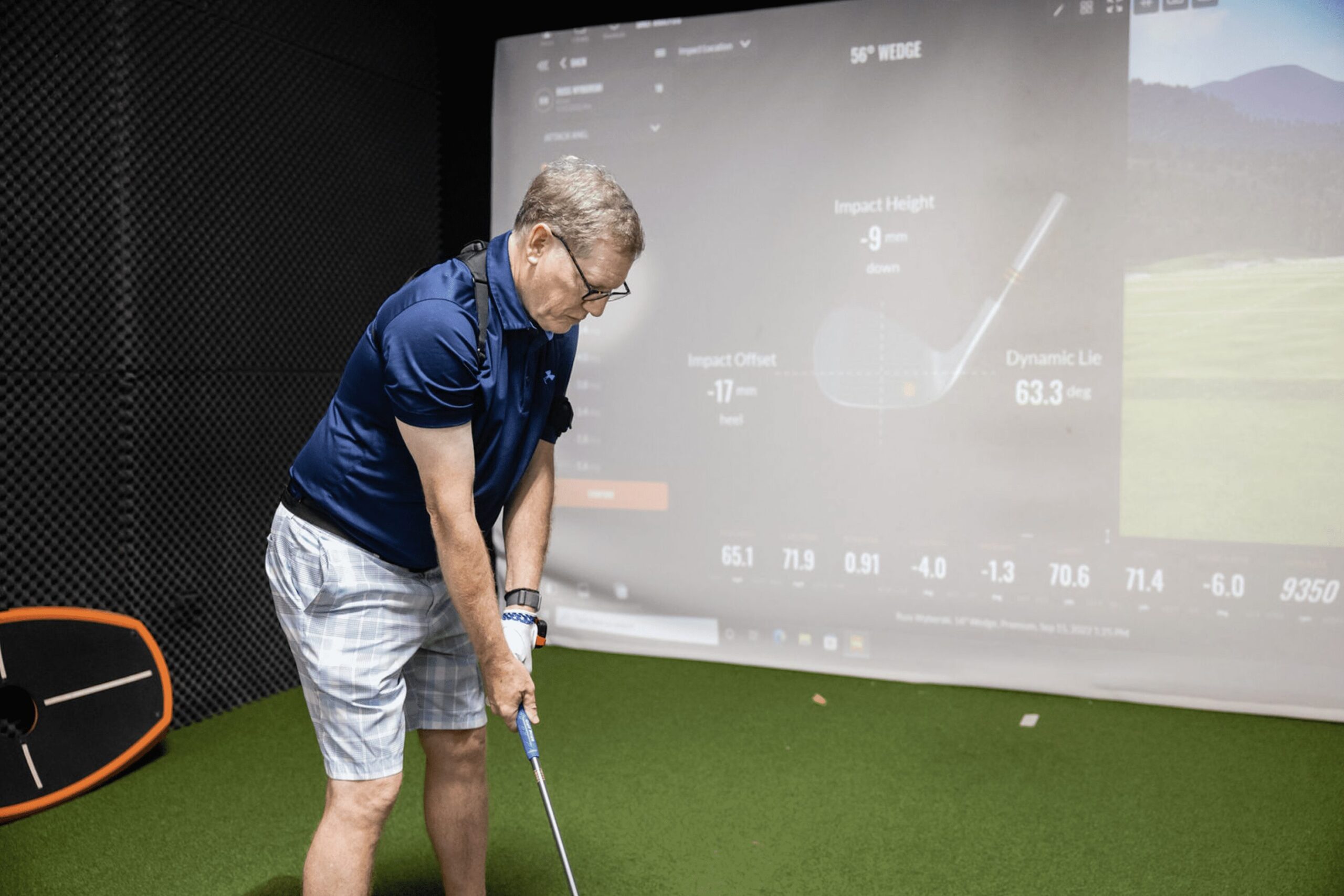 TrackMan4 Swing Analysis for Beachwood Golfers Senior golfer using TrackMan4 simulator for swing analysis indoors